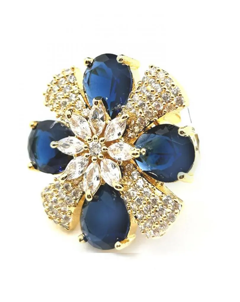 ANILLOS GRANDES DE FLOR DECORADA EN AZUL MARINO Y CIRCONITAS